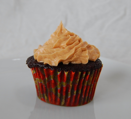 peanut butter frosting on chocolate cupcake peanut butter frosting on chocolate cupcake
